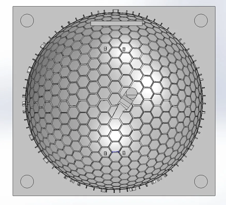 CAD render looking down on a square block with a shallow dome covered in a hexagonal groove pattern